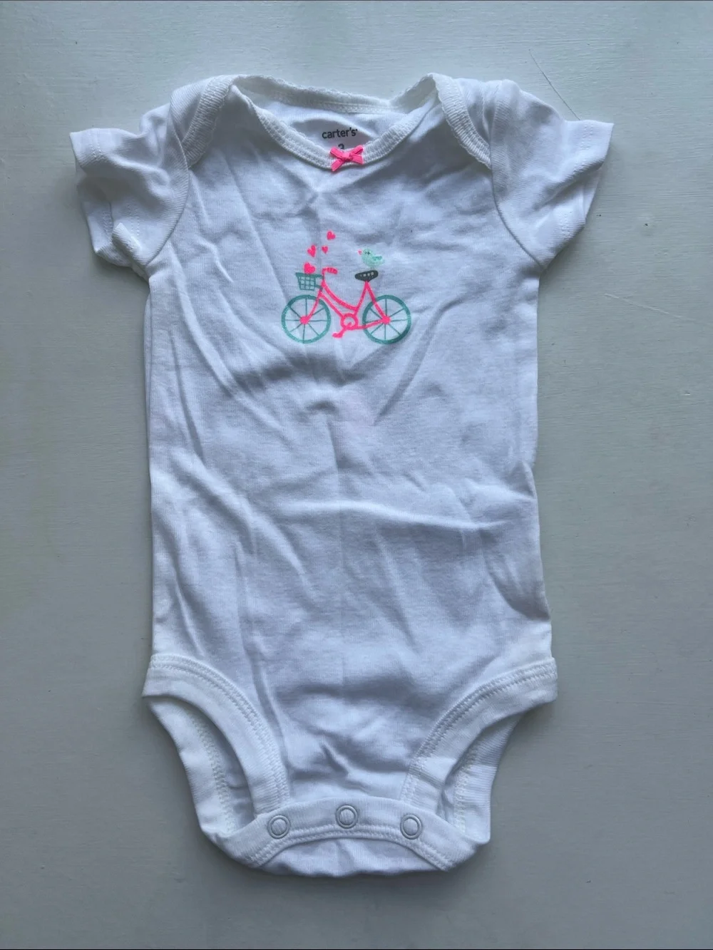 Carter's White Onesie with Pink and Teal Bike Graphic